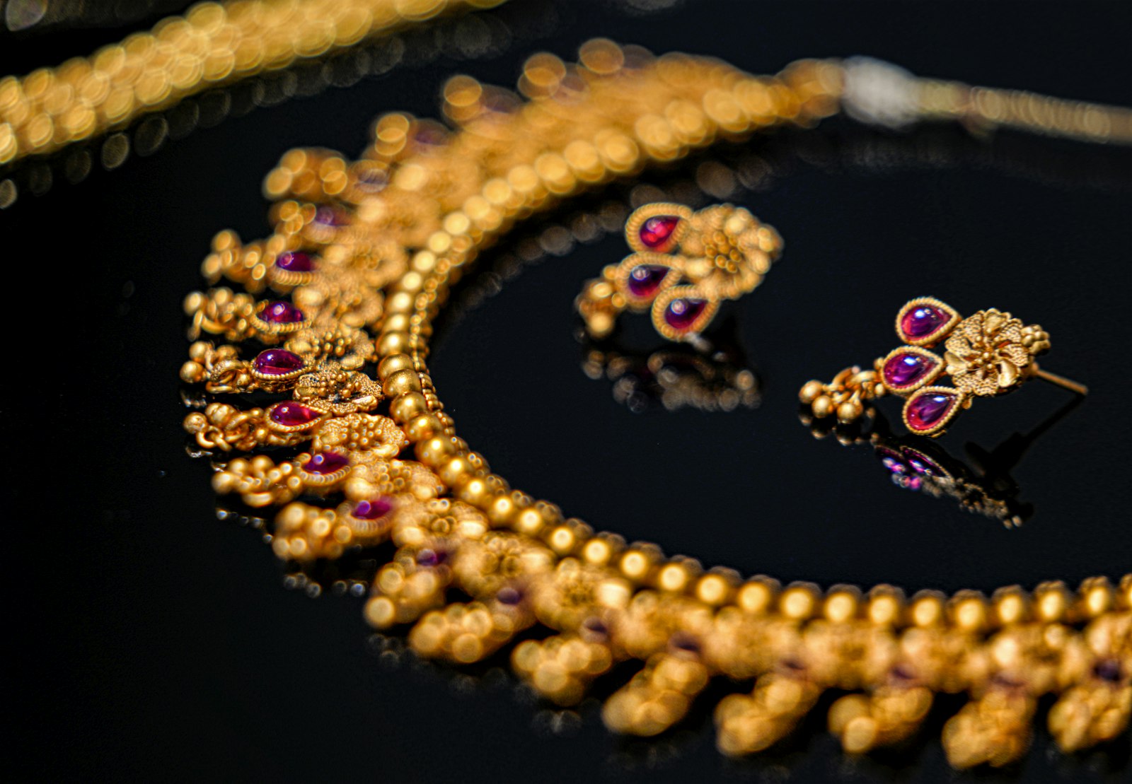 A gold and purple beaded necklace