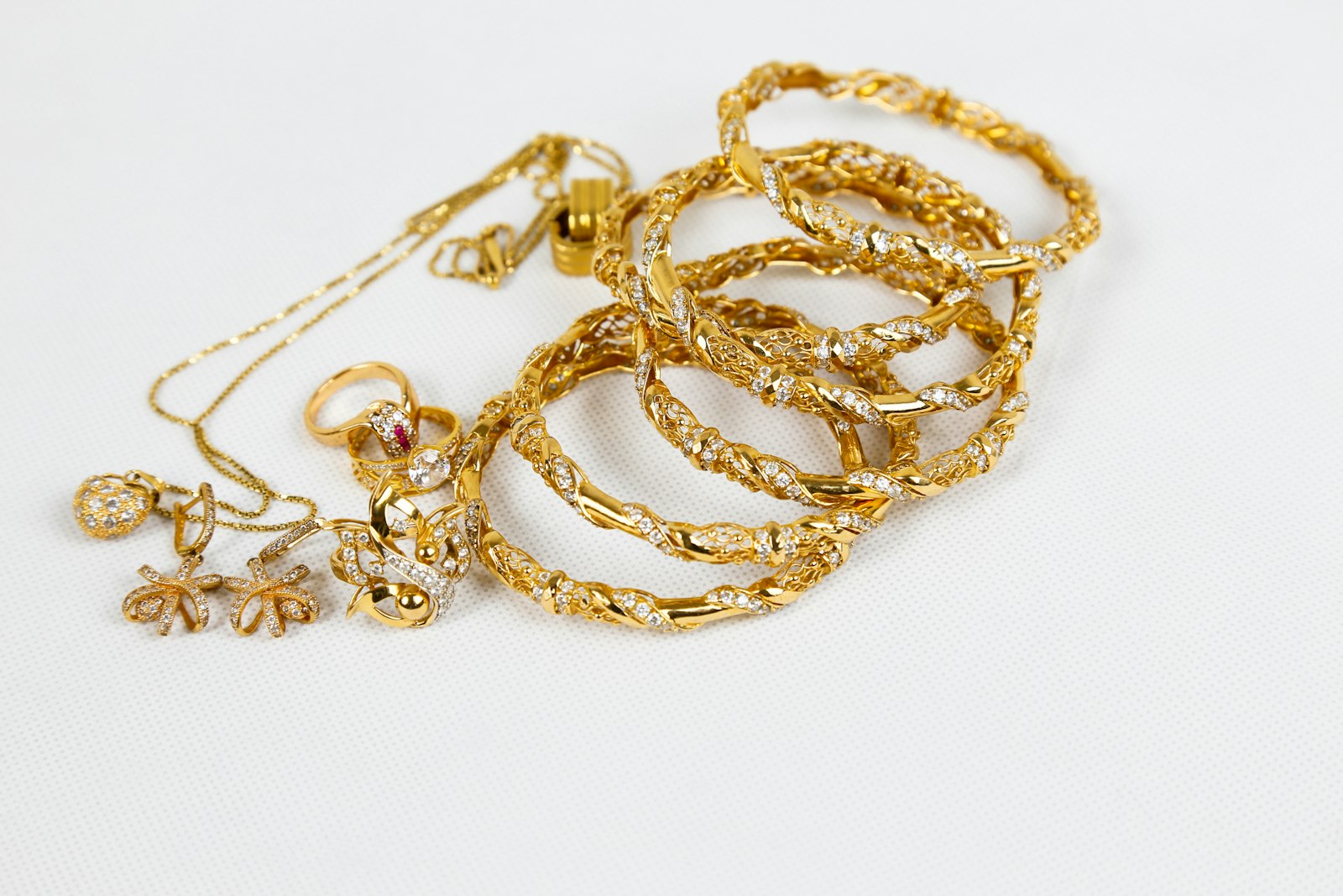 A pile of tangled and broken jewellery chains